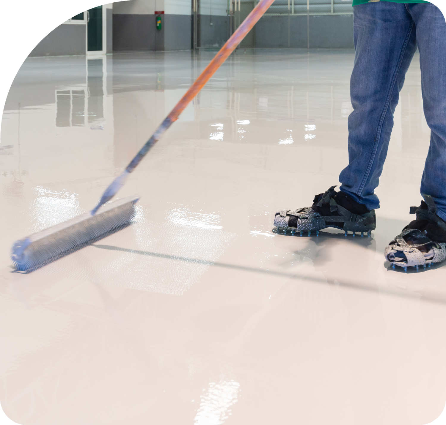 man rolling epoxy floor