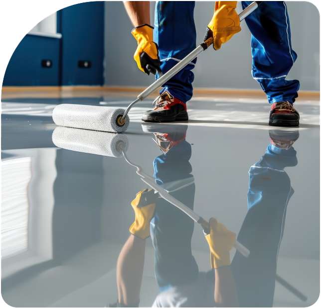 man rolling floor epoxy